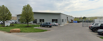 Olathe apartment for rent - a building with cars parked outside of it