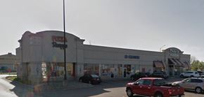 Kansas City apartment for rent - a shopping center with cars parked in front of it