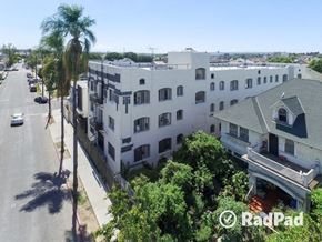 Los Angeles apartment for rent - an aerial view of a white building and a street