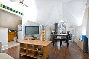 Ottawa apartment for rent - A living room with a television and a chair.