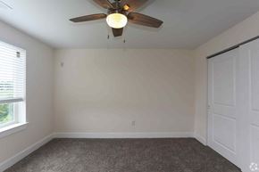 Philadelphia apartment for rent - an empty bedroom with a ceiling fan and a window