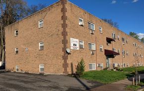 Philadelphia apartment for rent - a brick building with a sign on the side of it