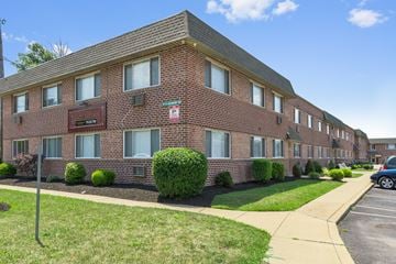 Philadelphia apartment for rent - a brick apartment building with a sidewalk in front of it
