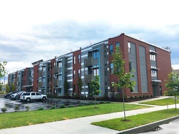 Indianapolis apartment for rent - a new apartment building with cars parked in front of it
