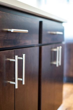 Ames apartment for rent - a kitchen with wooden cabinets and a refrigerator