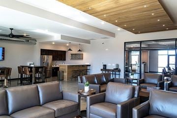 Ames apartment for rent - a living room with couches and chairs and a kitchen