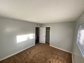 Long Beach apartment for rent - an empty living room with a door to a closet