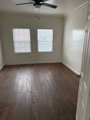 Los Angeles apartment for rent - A room with a ceiling fan and two windows.