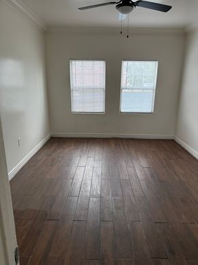 Los Angeles apartment for rent - A room with a ceiling fan and two windows.