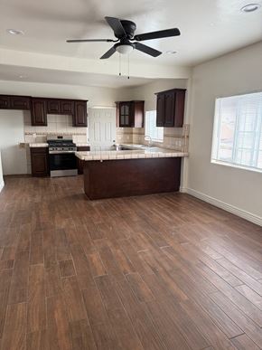 Los Angeles apartment for rent - A kitchen with wooden floors and a ceiling fan.