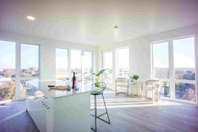 Sacramento apartment for rent - an open kitchen and dining area with large windows and a white counter top