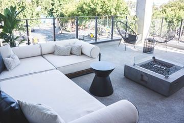 Sacramento apartment for rent - a living room with white couches and a coffee table