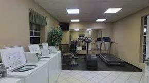 Springfield apartment for rent - A room with a treadmill, exercise bike, and other workout equipment.