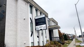 Hamilton apartment for rent - a building with a sign in front of it