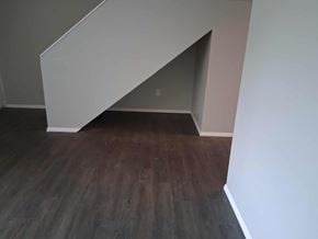Springfield apartment for rent - A corner of a room with a wooden floor and white walls.