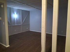 Springfield apartment for rent - A room with a carpeted floor and a window covered with frosted glass.