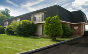 Springfield apartment for rent - A house with a green bush in front of it.