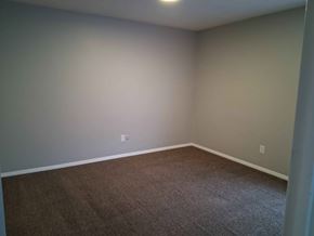Springfield apartment for rent - A room with a carpeted floor and a white wall.