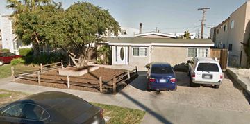 San Diego apartment for rent - A car is parked in front of a house.