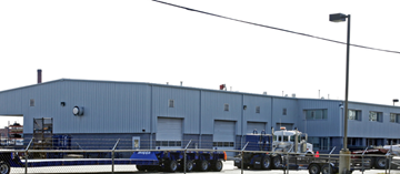 North Chesterfield apartment for rent - A blue truck is parked in front of a blue building.