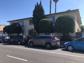 Compton apartment for rent - a building with cars parked in front of it