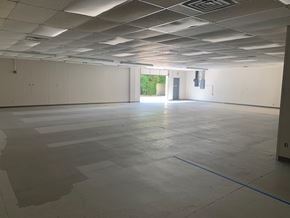 Richardson apartment for rent - an empty office space with white walls and a concrete floor