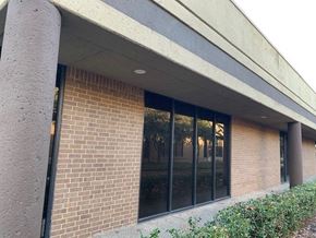 Richardson apartment for rent - a brick building with a large glass window