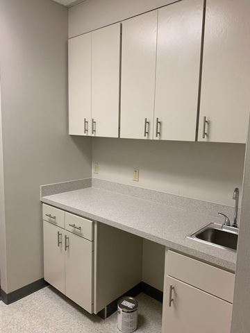 Richardson apartment for rent - an empty kitchen with white cabinets and a sink