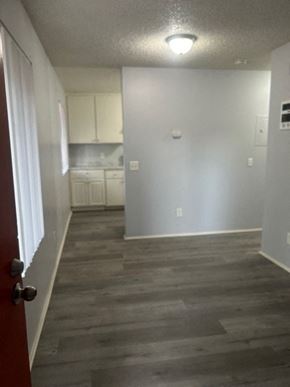 San Diego apartment for rent - A room with a red door and a grey floor.