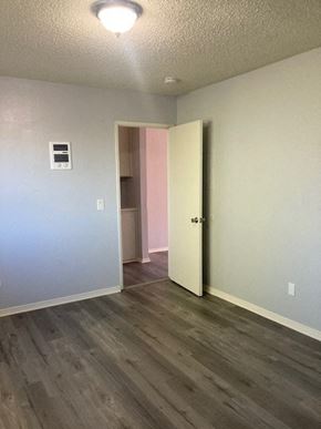 San Diego apartment for rent - A room with a white door and a grey wall.