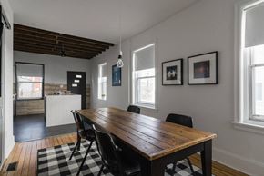 Narberth house for rent - A dining room with a wooden table and chairs.
