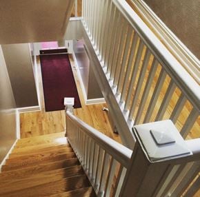 Astoria apartment for rent - the stairway up to the second floor of a home with a red carpet