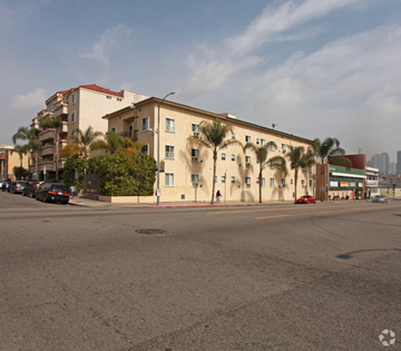Los Angeles apartment for rent - an apartment building on the corner of a street with palm trees