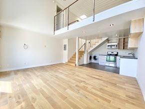 Los Angeles apartment for rent - a renovated living room and kitchen with a wood floor