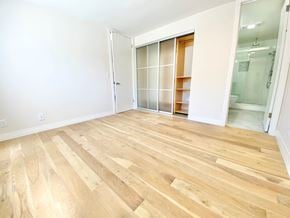 Los Angeles apartment for rent - a renovated living room with wood flooring and a closet