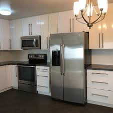 Los Angeles apartment for rent - a kitchen with white cabinets and a stainless steel refrigerator