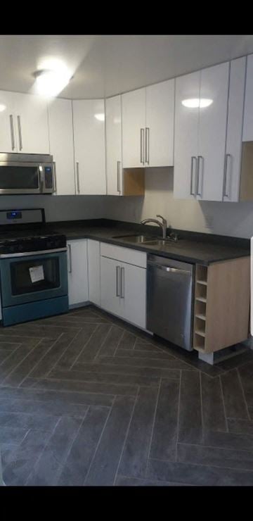 Los Angeles apartment for rent - a kitchen with white cabinets and stainless steel appliances