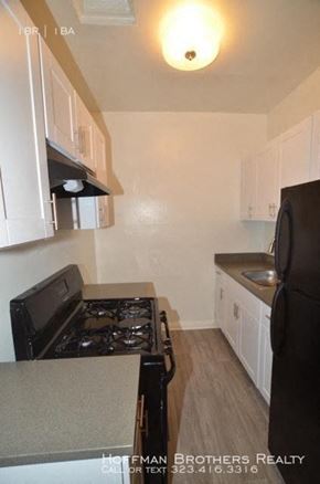 Los Angeles apartment for rent - a kitchen with a black stove and a black refrigerator