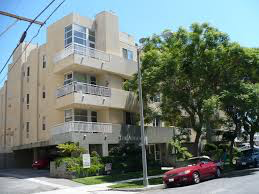Los Angeles apartment for rent - a red car parked in front of a building