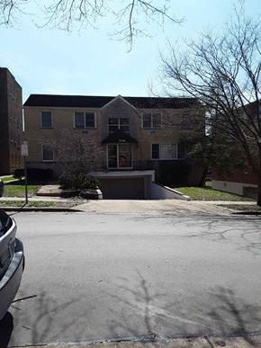 Clayton apartment for rent - a large brick house with a driveway in front of it