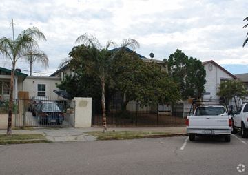 San Diego apartment for rent - a white truck parked in a parking lot in front of a house