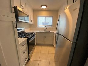 San Diego apartment for rent - A kitchen with a stove, sink, and refrigerator.