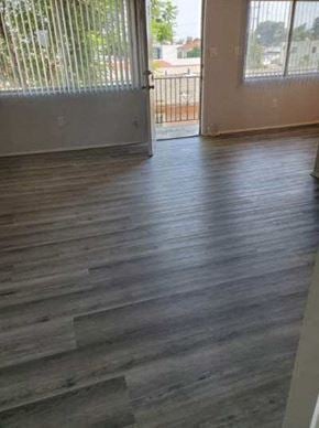 San Diego apartment for rent - a living room with wooden floors and a balcony