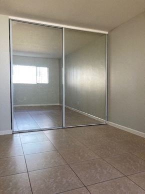 San Diego apartment for rent - an empty living room with sliding glass doors