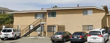 San Diego apartment for rent - a building with cars parked in a parking lot