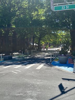 Astoria apartment for rent - A street view of 33rd street with trees and a crosswalk.