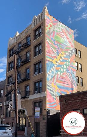 Astoria apartment for rent - A building with a mural on the side of it.