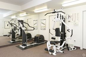 Comstock Park apartment for rent - a gym with weights and other exercise equipment in a building