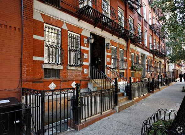 New York apartment for rent - a red brick building with stairs in front of it