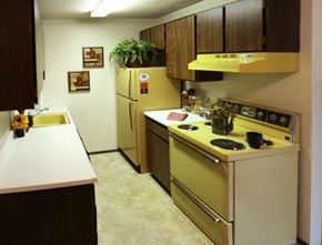 Spokane apartment for rent - a kitchen with a yellow stove and a refrigerator